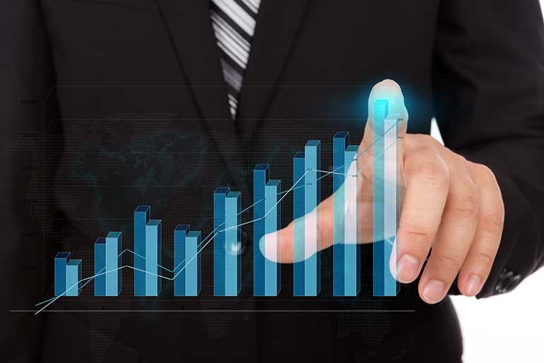 Businessman pointing at bar chart